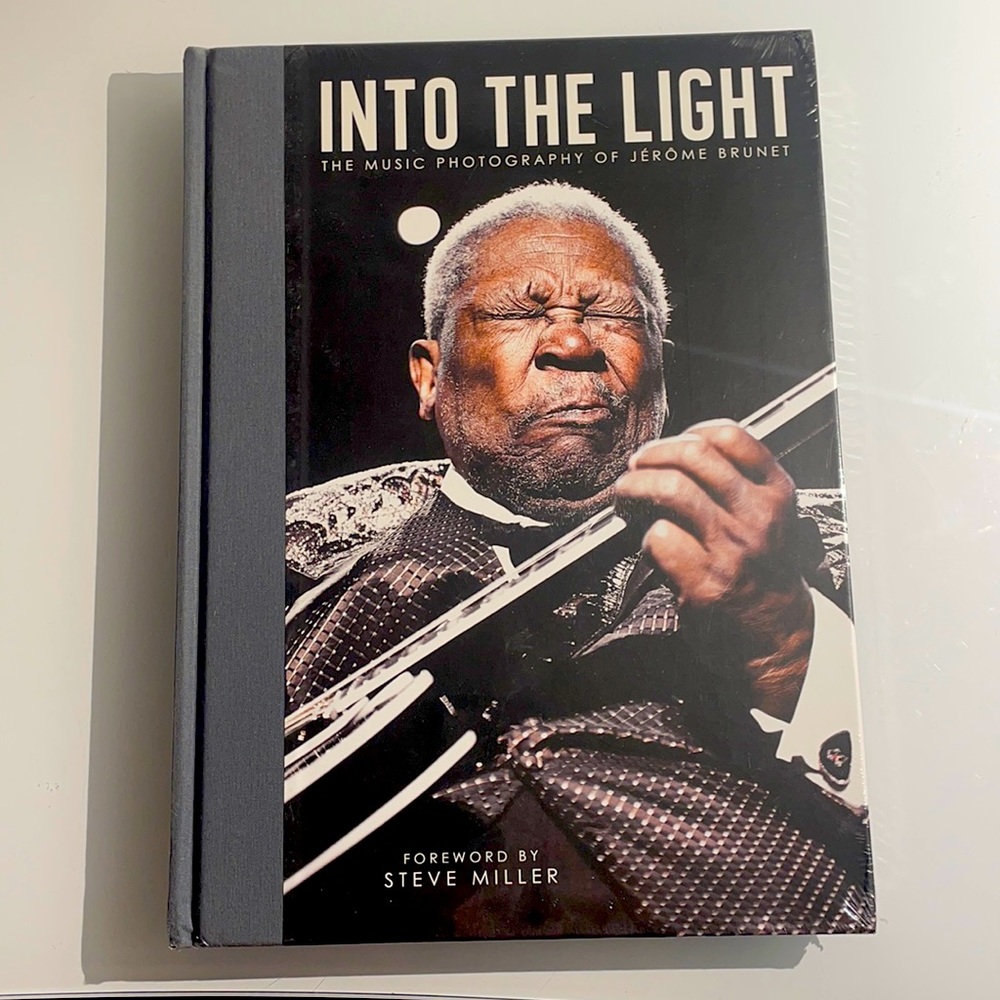 Book into the light. The book is new. It’s sealed